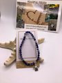 Sodalite gemstone healing bracelet with turtle charm.